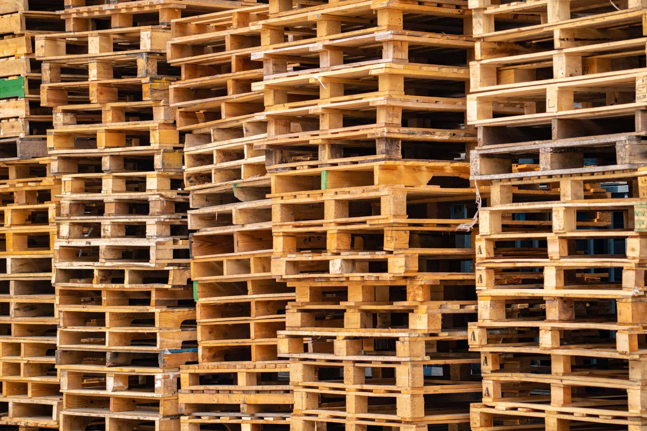 Stacks of wooden pallets in a warehouse