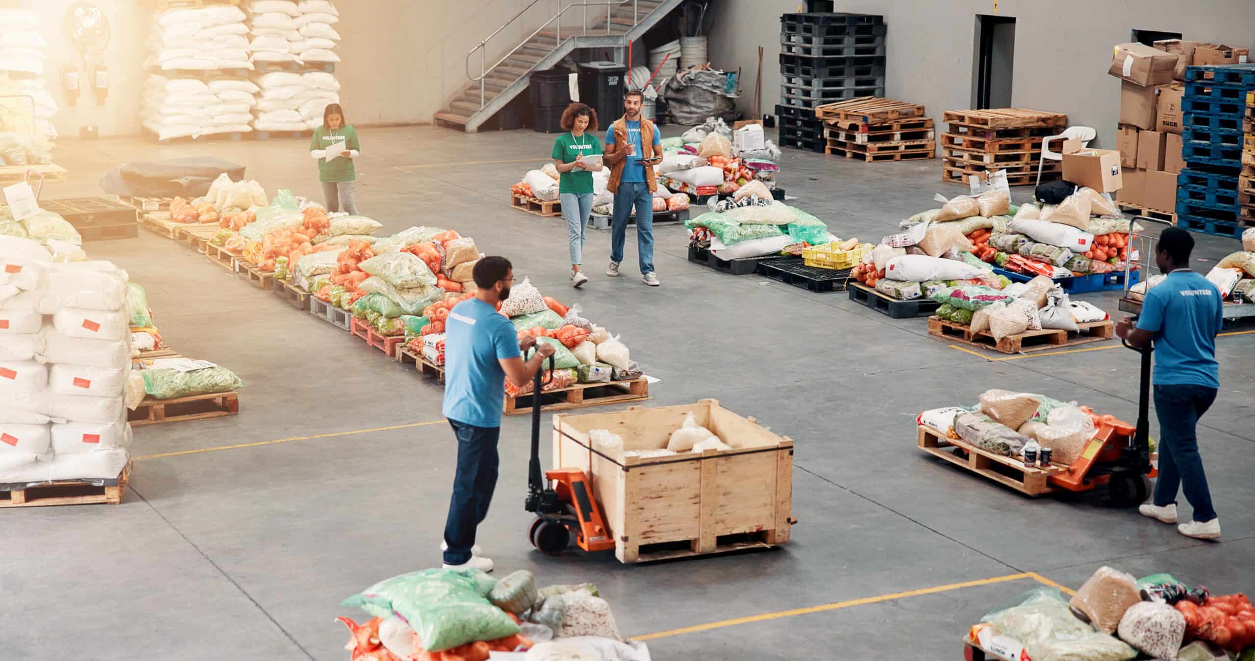 People, volunteer and grocery distribution at warehouse